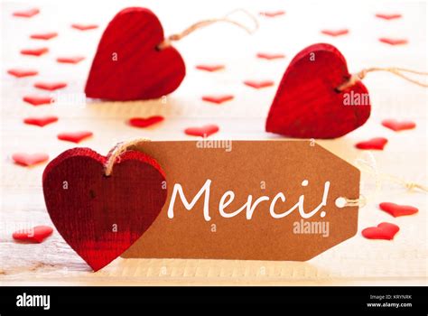 Label With French Text Merci Means Thank You Many Red Heart Wooden