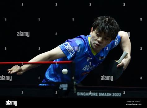 Yukiya Uda Of Japan Plays A Shot Against Dang Qiu Of Germany During