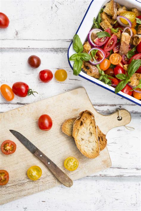 Panzanella made of roasted Ciabatta, rocket, red onions, tomatoes and