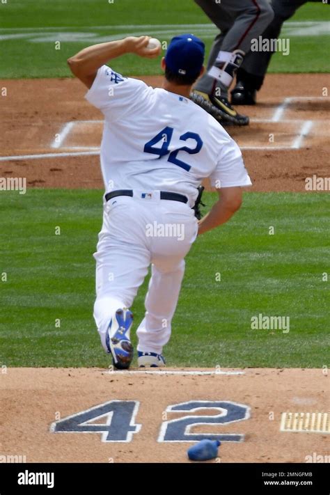 Los Angeles Dodgers Starting Pitcher Clayton Kershaw Throws To The Plate During The First Inning