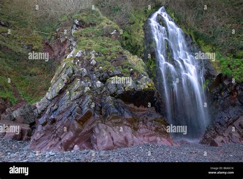 Clovelly beach waterfall Stock Photo - Alamy