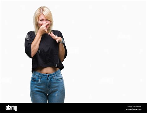 Young Beautiful Blonde Woman Over Isolated Background Smelling