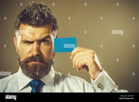 Handsome Bearded Man In White Shirt And Blue Tie Showing Blank Mockup