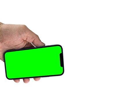 Premium Photo Female Hand Holding A Smartphone With Chroma Key On The