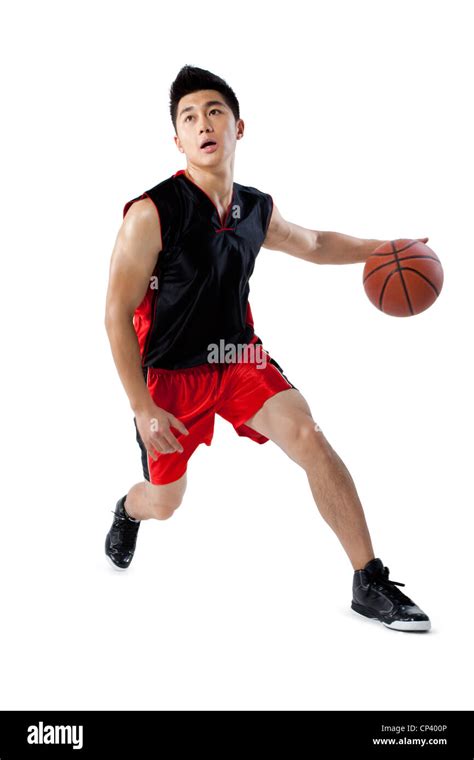 Man dribbling basketball Stock Photo - Alamy