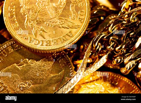 Real Gold coins over dark background Stock Photo - Alamy