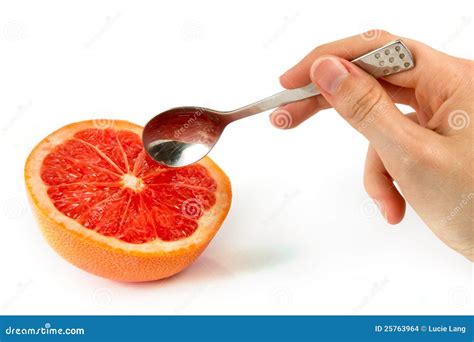 Pink Grapefruit With Hand Holding A Spoon Stock Photo Image Of Pink