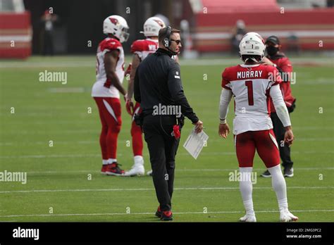 Arizona Cardinals head coach Kliff Kingsbury talks with quarterback ...