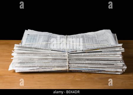 Stack Of Newspapers Tied Up With String Stock Photo Alamy