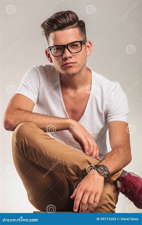 Smart Man Wearing Glasses Sitting On A Chair With Legs Crossed Stock Image Image Of Sitting