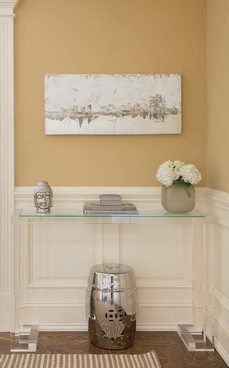 White And Gold Foyer Features Top Half Of Walls Clad In Yellow