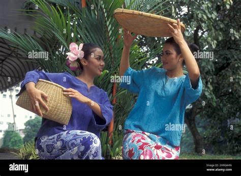 Women in traditional malay dress in the city of Kuala Lumpur in ...