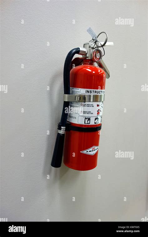 A Fire Extinguisher On A Wall Stock Photo Alamy