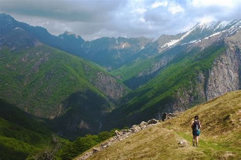 Premium Photo | Tourist hiking in the mountains in piedmont, italy on a cloudy day