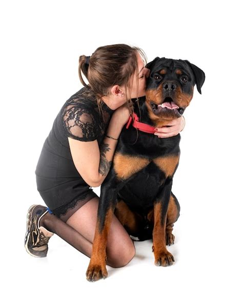 Premium Photo | Rottweiler and woman in studio