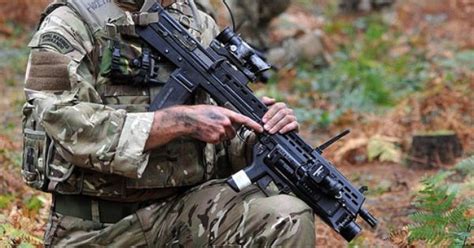 Royal Marine Commandos On Exercise In British Woodland By Defence