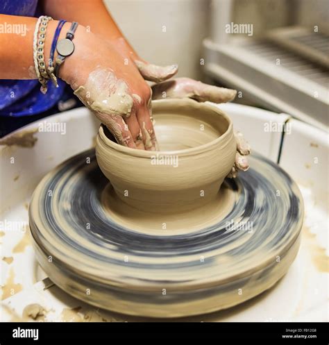 Woman Shaping Clay Bowl On Pottery Wheel Stock Photo Alamy