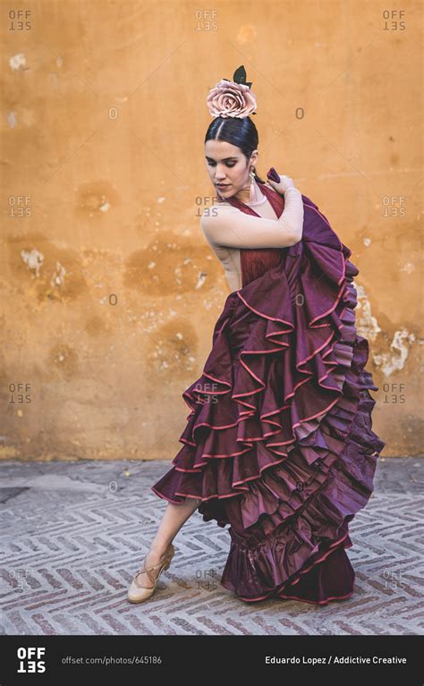 Flamenco Dancer With Typical Costume In The Streets Of Seville Stock