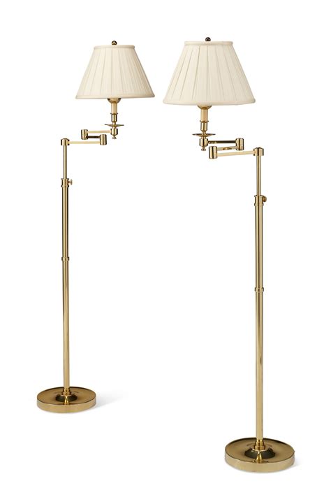 A Pair Of Polished Brass Swing Arm Floor Lamps Modern Christies