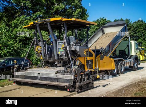 Road finisher on a construction site Stock Photo - Alamy