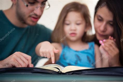 Family Reading the Bible Together — Stock Photo © Balazs #120427610