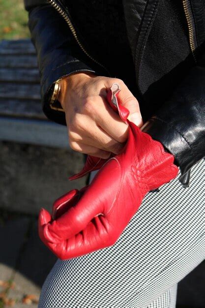 Premium Photo Midsection Of Woman Wearing Red Glove In Sunny Day