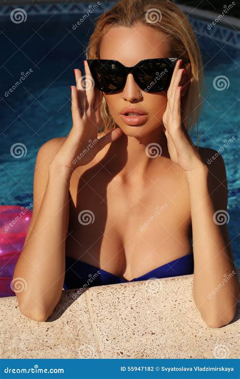 Woman With Blond Hair In Elegant Bikini With Sunglasses Stock Photo