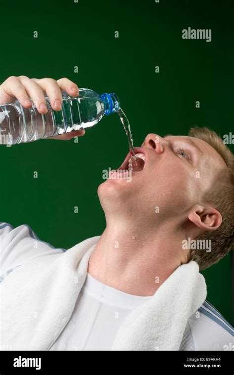 Man drinking from water bottle Stock Photo - Alamy