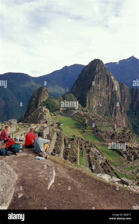 South America Peru Machu Picchu Tourists Viewing The Stone Walls And