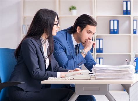 Two Employees Working In The Office Stock Photo Image Of Focused