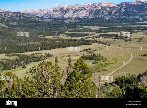 Beautiful Valley Mountain View With A Winding Dirt Road In The Frank