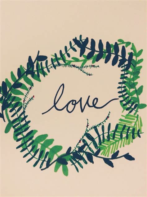 The Word Love Is Written In A Heart Shaped Frame Made Out Of Leaves