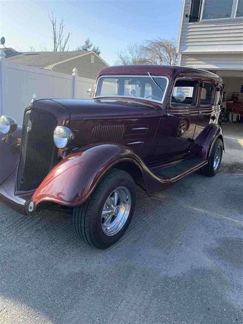 1934 Plymouth DeLuxe PE Sedan Red RWD Automatic For Sale Photos