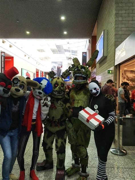 Four People in Fnaf Cosplay at an Airport