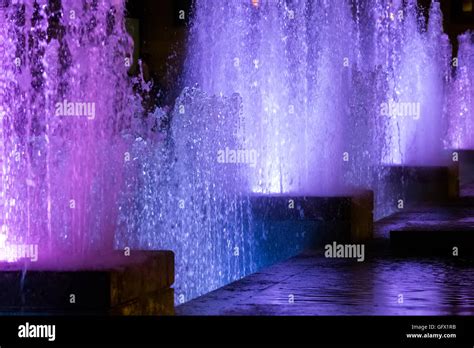 Color water fountain at night Stock Photo - Alamy