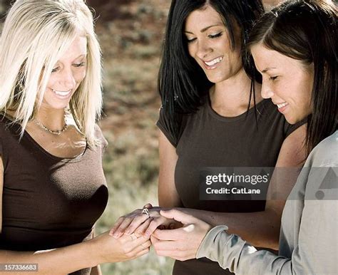 Admiring Friends Engagement Ring Photos And Premium High Res Pictures