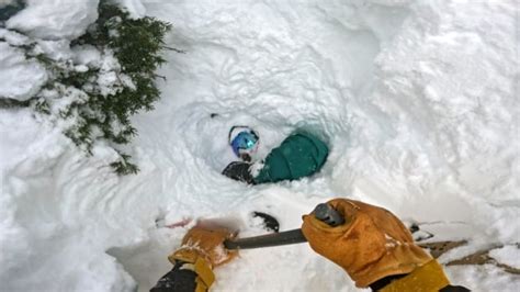 Dramatic Video Shows Skier Racing Against Time To Dig Out Buried