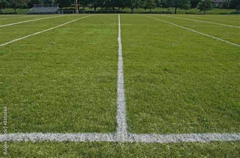 White boundary lines of American football playing field. Stock Photo | Adobe Stock