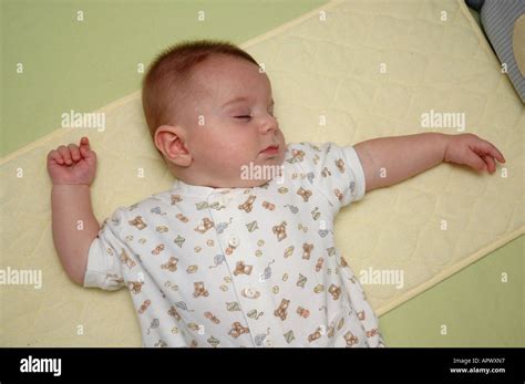 Four-month-old male baby exhibits classic ATNR positioning while ...