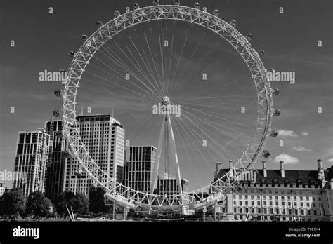 The London Eye On The South Bank Of The River Thames At Night In London