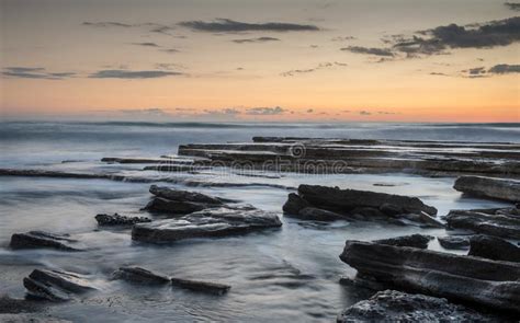 Beautiful Sunset On A Rocky Beach Stock Photo Image Of Places Scene