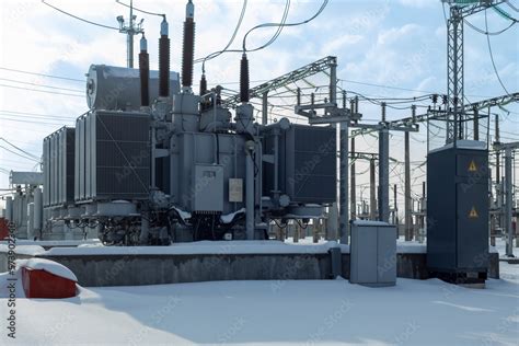 High voltage transformer substation in winter. Stock Photo | Adobe Stock