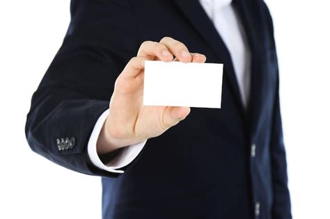 Hombre Elegante En Traje Con Tarjeta De Visita Aislada En Blanco Foto