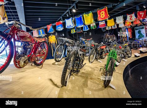 A Selection Of British Speedway Bikes On A Banked Display And Rider S