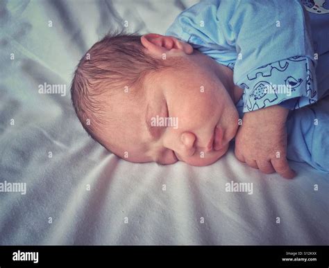 Newborn baby boy sleeping Stock Photo - Alamy