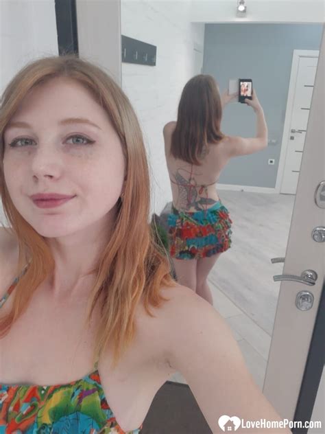 Hot Redheaded Girl Doffs Her Colorful Dress And Poses Naked In The Mirror CoedCherry