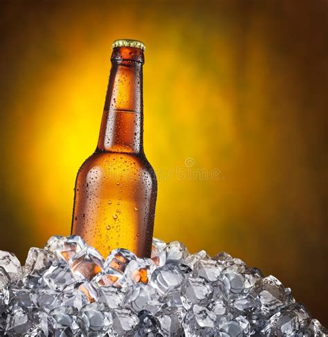 Cold Bottle of Beer in the Ice Cubes. Stock Photo - Image of cubes ...