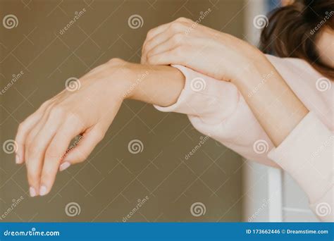 Relaxed Hands Of A Young Girl Hanging From A Chair Stock Photo Image