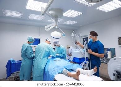 Team Professional Doctors Performing Operation Surgery Stock Photo