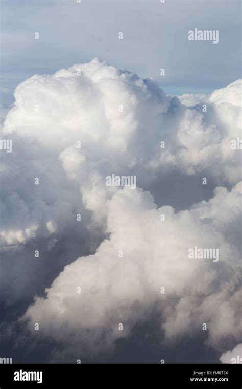 Above the clouds, view from airplane window Stock Photo - Alamy